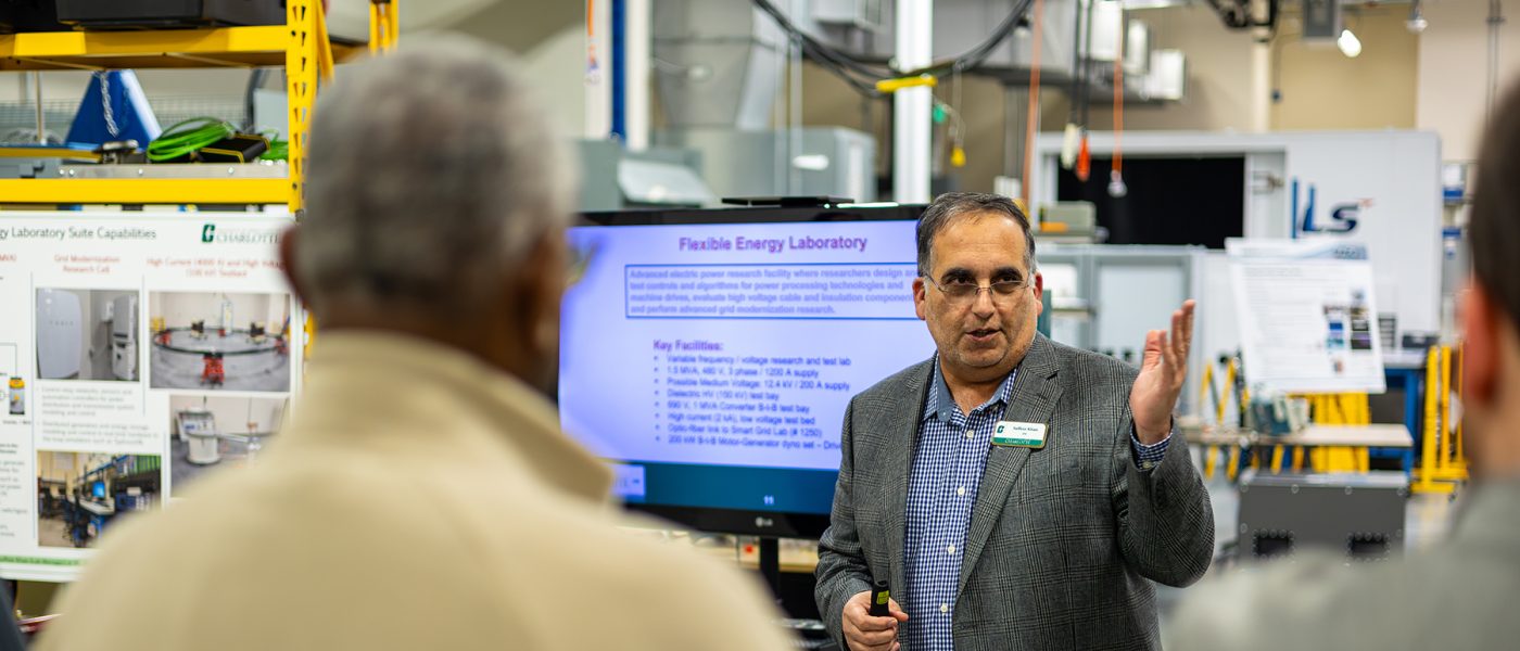 Professor speaking to a group of people